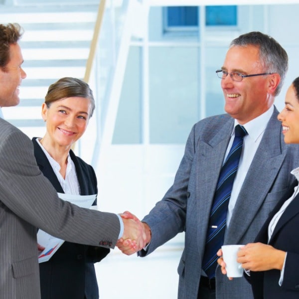 In this picture there are several business people greeting each other at a Business Networking event in Las Vegas Nevada