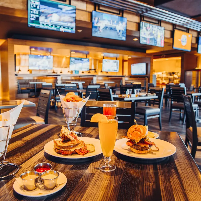 This image is of Food and drinks plus sports on TV at the Raiders Tavern & Grilll at M Resort