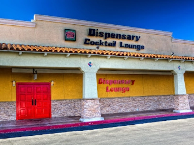 The red door entrance to the Dispensary Lounge dive bar in Las Vegas