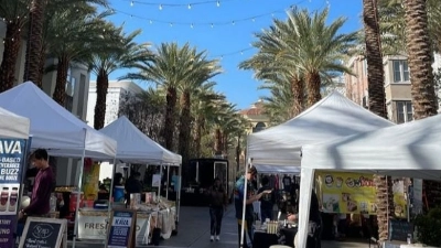 The picture shows a row of vendor tents at the Downtown Summerlin Farmer's Market in Las Vegas