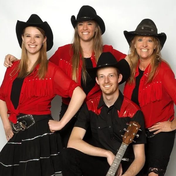 A cast photo of Mamas Wranglers band performing at the Firelight Barn Theater